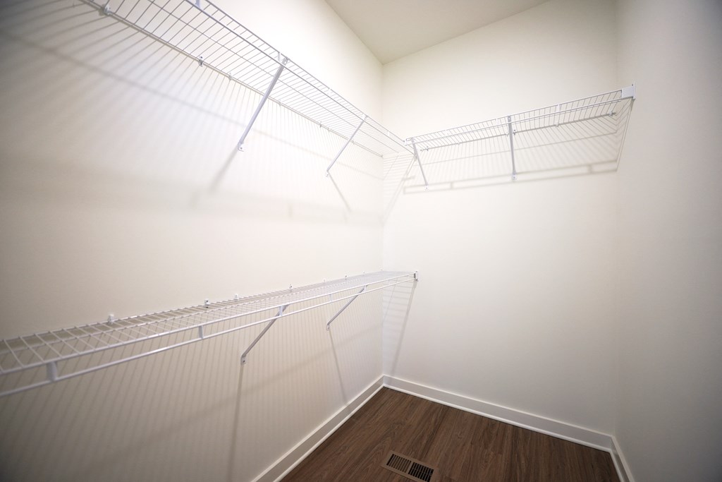Walk-in closet with shelving at West Row Lofts and Townhomes in Birmingham, AL